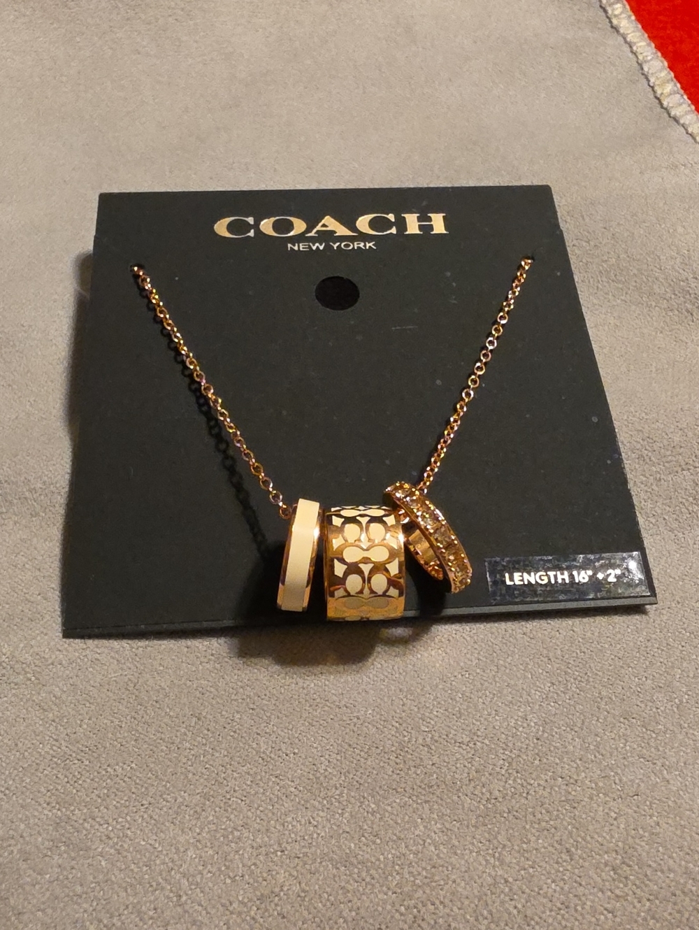 Coach Rose Gold-Tone Three-Ring Pendant Necklace